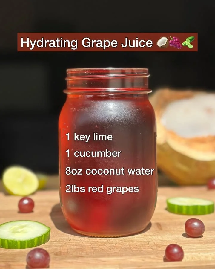 A glass of hydrating grape juice served with fresh grapes beside it.