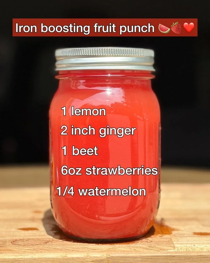 Glass of iron boosting fruit punch with colorful fruits