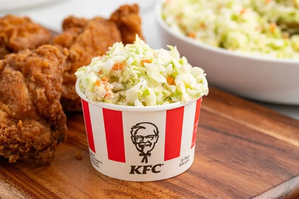 Bowl of homemade KFC coleslaw with fresh ingredients and creamy dressing
