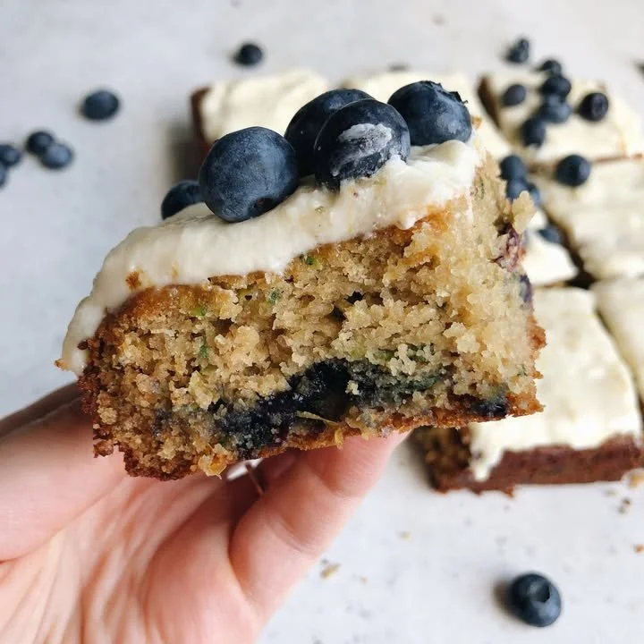 Delicious Lemon Blueberry Zucchini Cake slice on a plate