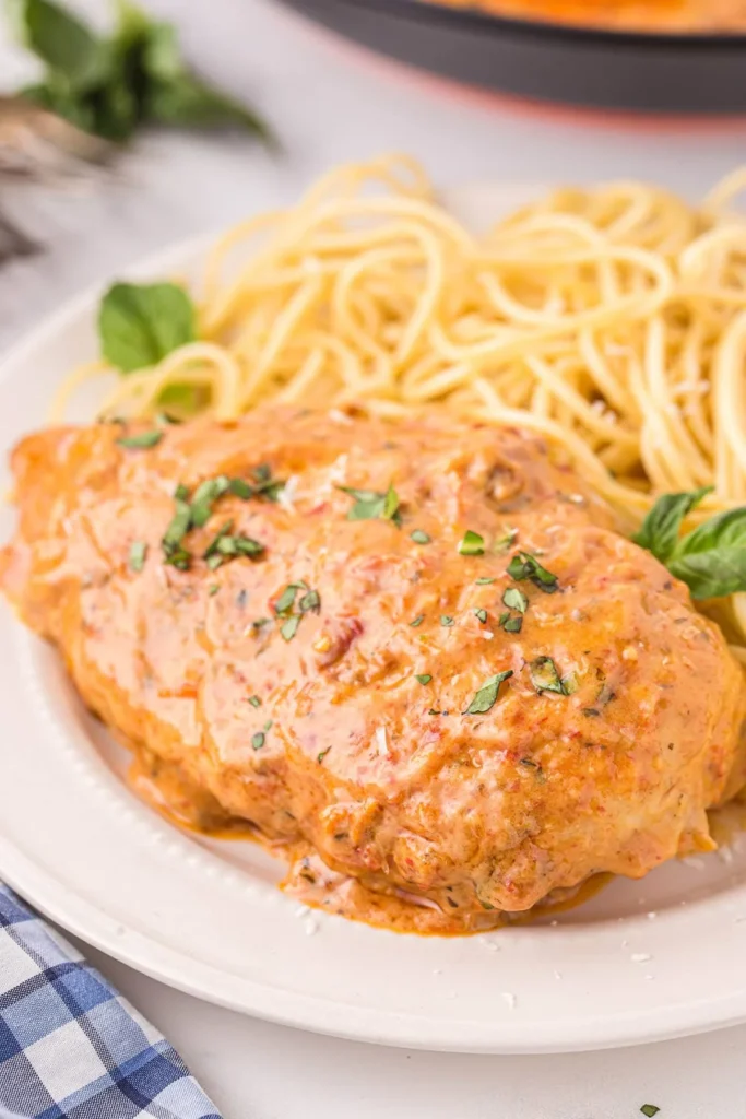 Delicious Marry Me Chicken recipe served in a creamy sauce with herbs and spices.