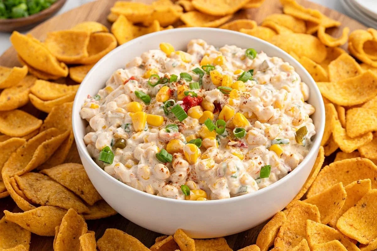 Delicious Mexican corn dip served in a bowl with tortilla chips