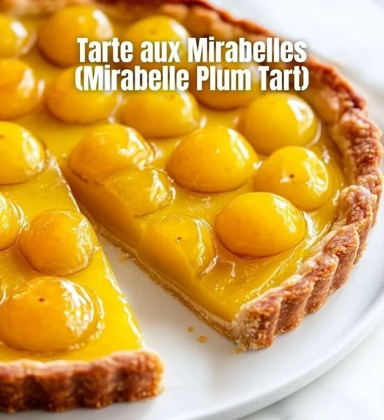 A beautifully baked mirabelle plum tart with fresh plums and a golden crust