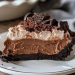Deliciously layered Mississippi Mud Pie with chocolate and a crunchy crust.