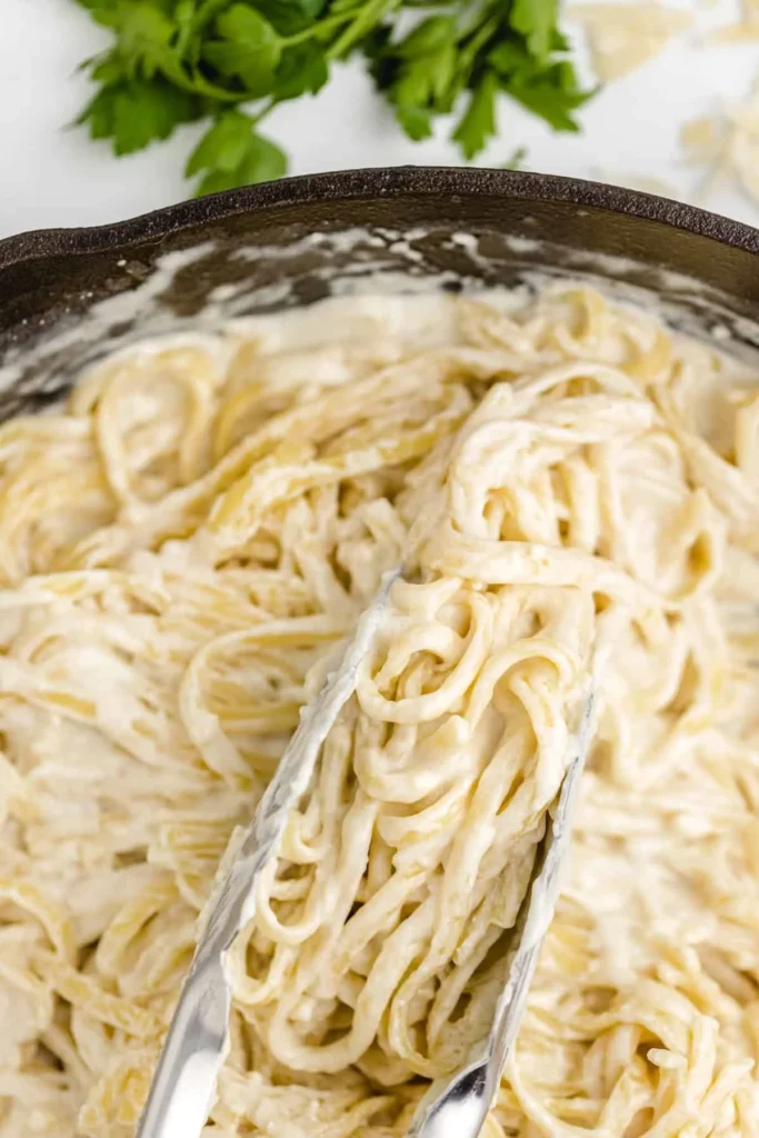 Creamy Olive Garden Alfredo Sauce served with pasta