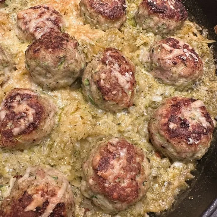 One Pan Pesto Baked Orzo with Chicken Meatballs dish