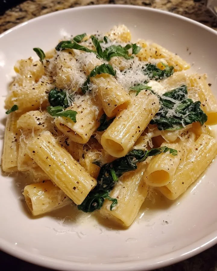 One-Pot Lemon Ricotta Rigatoni served on a plate with garnishes and a lemon slice