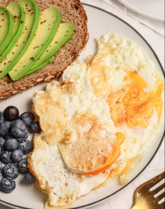 Delicious over hard eggs on a plate, a perfect breakfast option