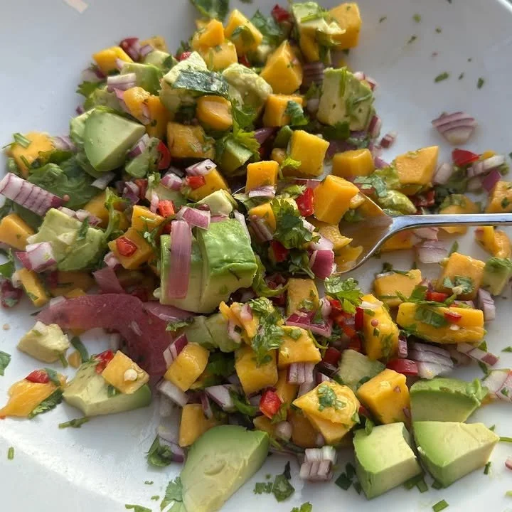 Colorful Peach Avocado Salsa served in a bowl with tortilla chips