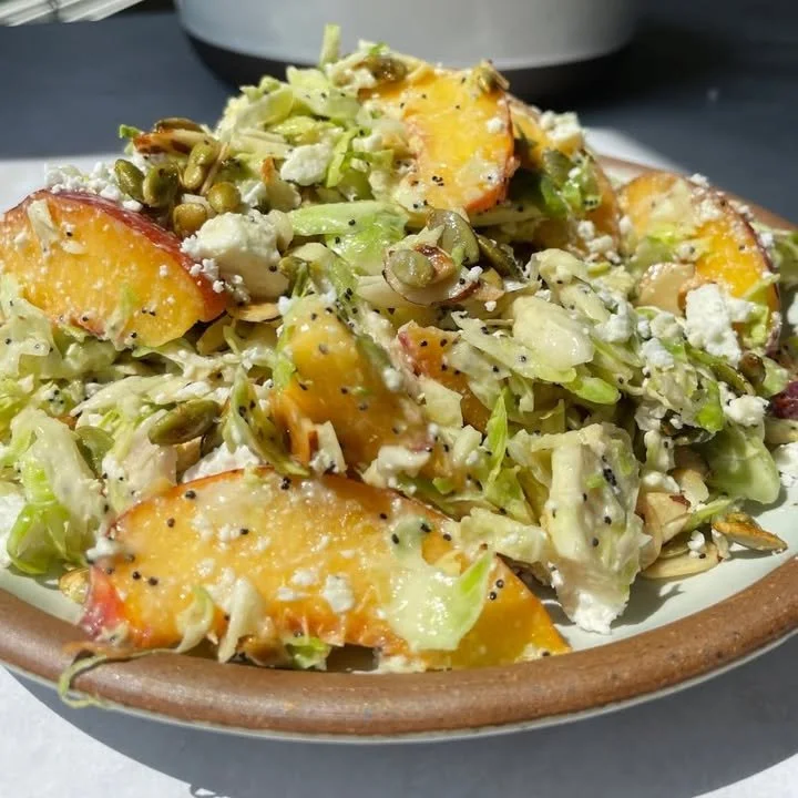 Peach Brussels Sprouts Salad with fresh ingredients and vibrant colors