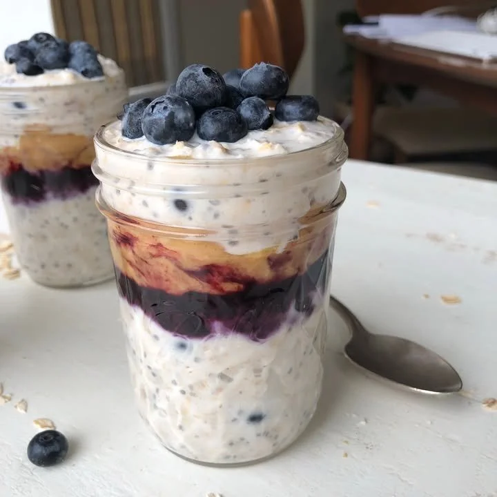 Peanut Butter Blueberry Overnight Oats in a mason jar with fresh blueberries on top