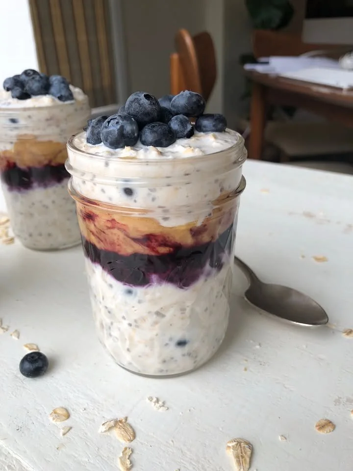 Peanut Butter Blueberry Overnight Oats in a glass jar topped with blueberries