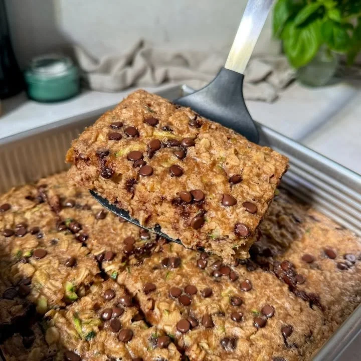 Peanut Butter Oatmeal Cookie Baked Oatmeal served in a bowl with toppings.