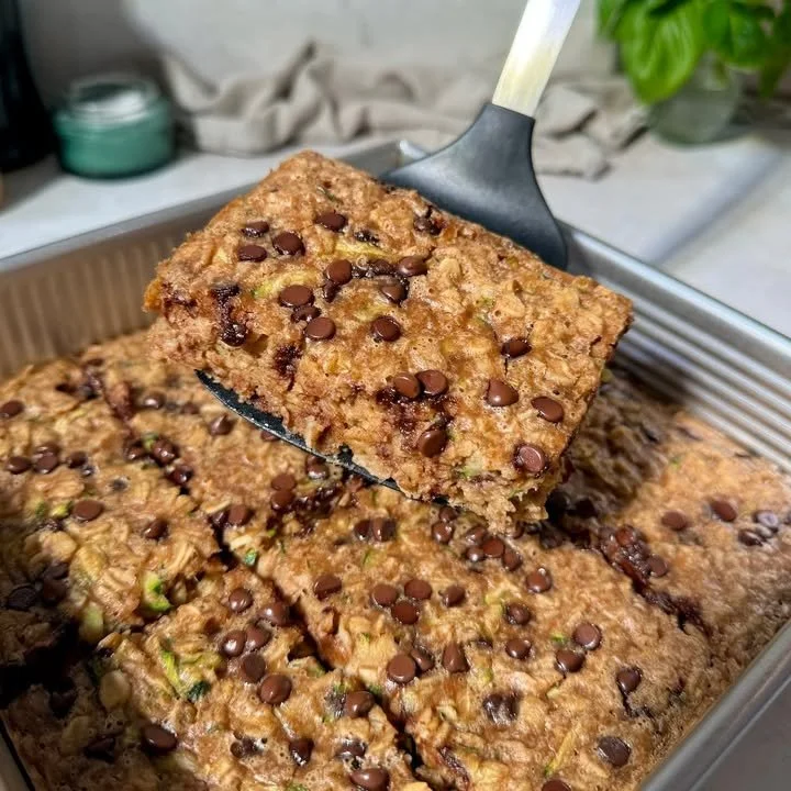 Peanut butter oatmeal cookie breakfast served on a wooden plate with fresh fruit.