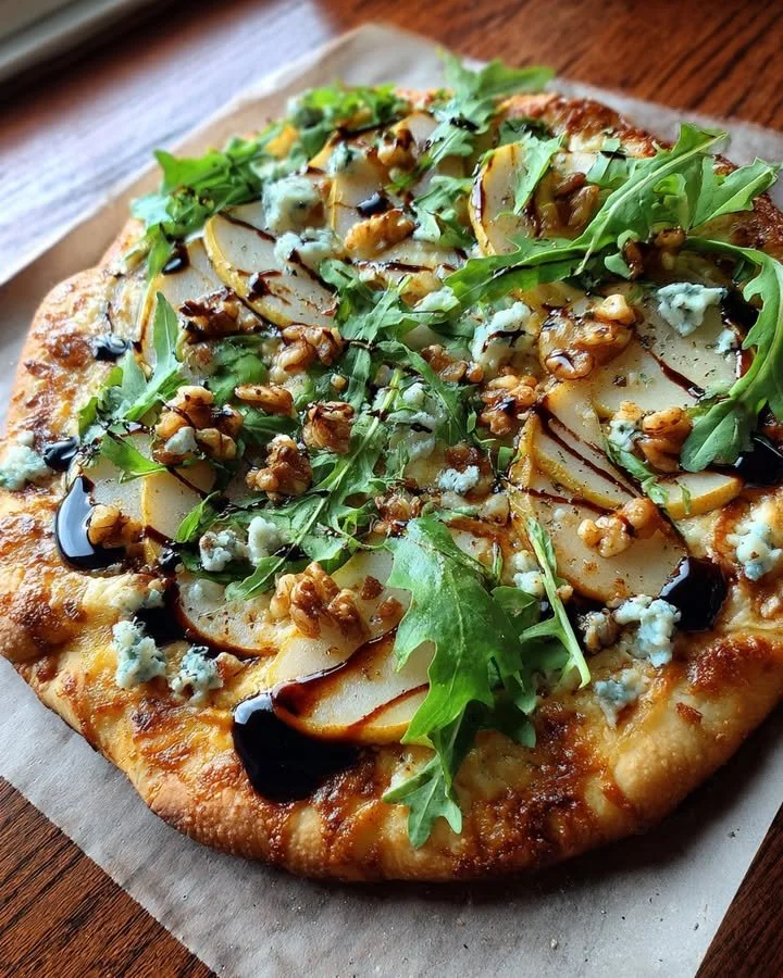 Delicious pear, gorgonzola, and walnut flatbread topped with balsamic glaze.