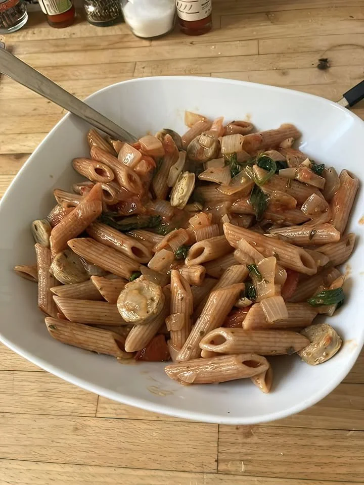 Delicious Penne Pasta with colorful vegetables in tomato sauce