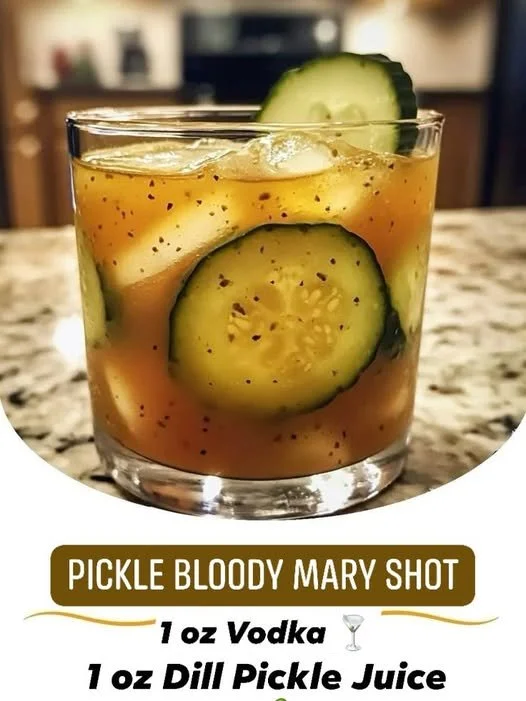 A refreshing Pickle Bloody Mary shot garnished with pickles and spices