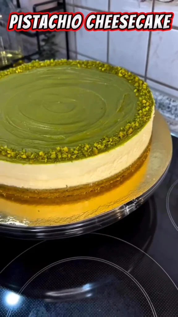 Creamy Pistachio Baklava-Style Cheesecake topped with nuts and honey