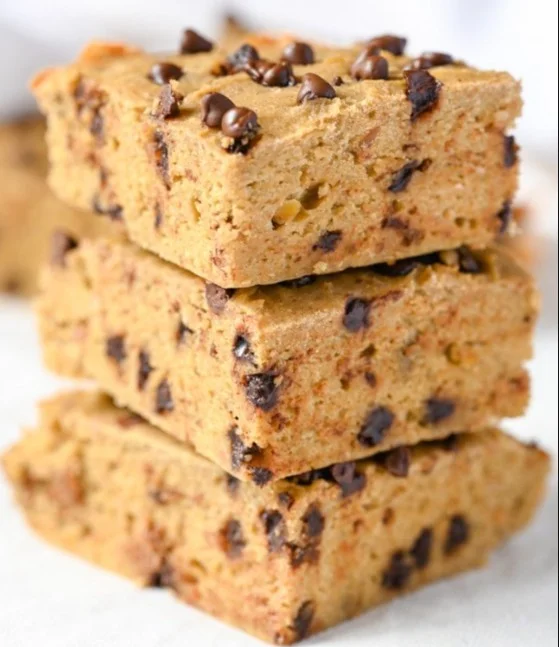 Delicious homemade protein blondies on a plate with chocolate chips