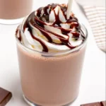 Protein milkshake in a glass with fruits and protein powder