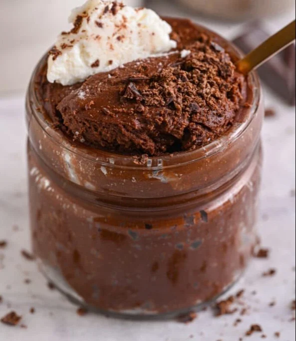 Delicious protein mousse topped with chocolate shavings and berries