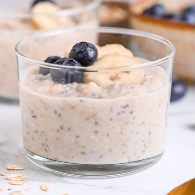 Bowl of protein overnight oats topped with fruits and nuts for a healthy breakfast