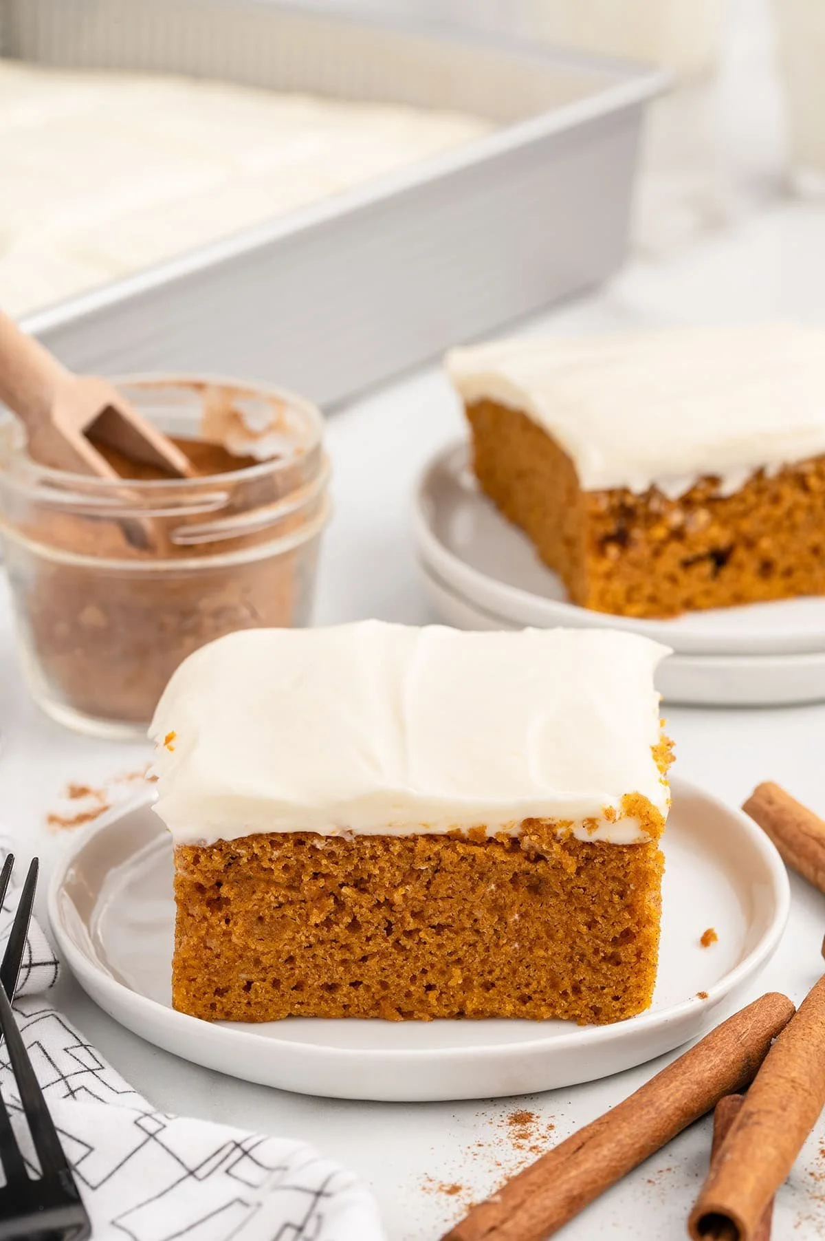Delicious homemade pumpkin bars topped with cream cheese frosting.