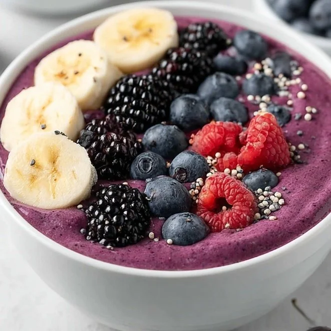 Healthy Purple Berry Power Bowl with mixed berries and granola