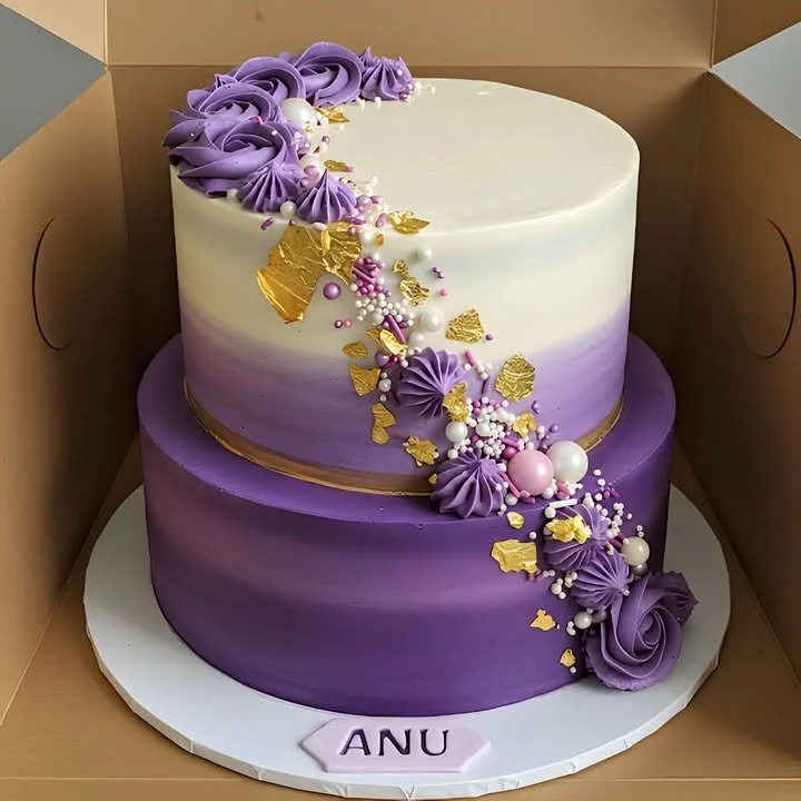 Beautiful Purple Ombre Celebration Cake with layers of vibrant purple frosting.