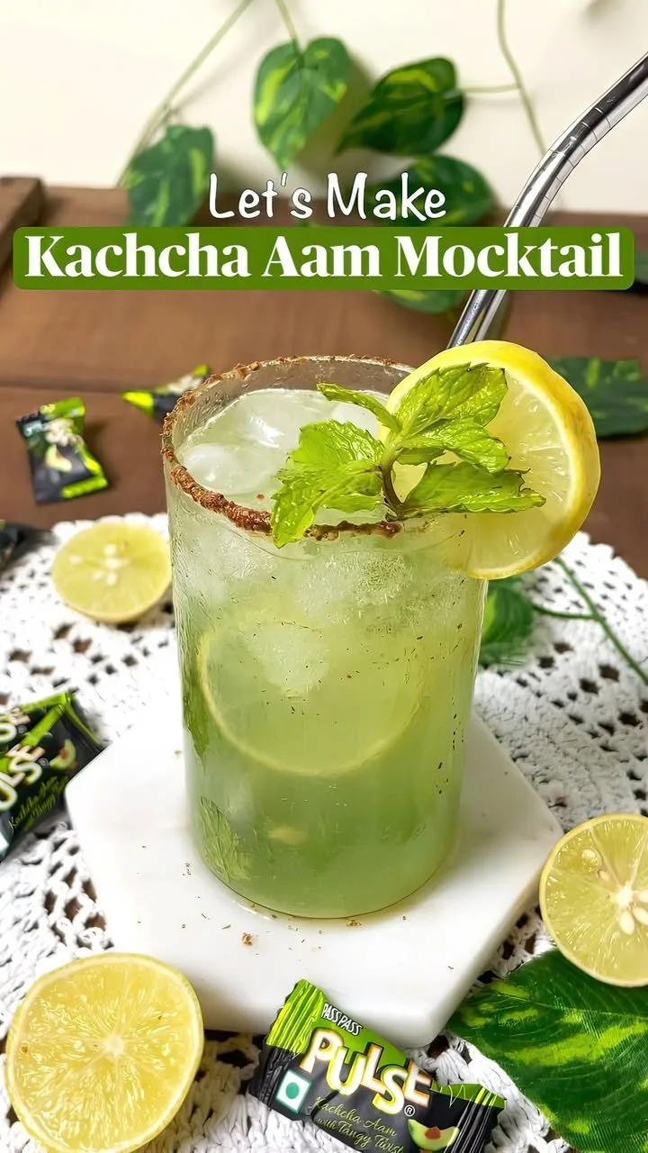 Delicious Raw Mango Mocktail served in a glass with garnishes