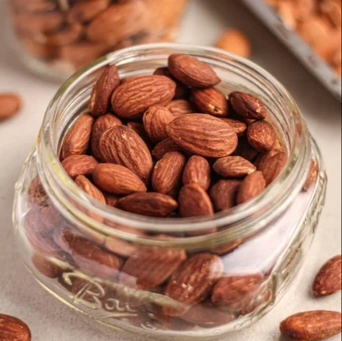Delicious bowl of roasted almonds ready to be enjoyed as a snack.