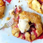Rustic fruit tarts topped with seasonal fruits and a flaky crust