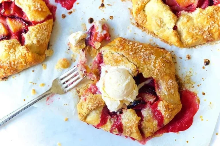 Rustic fruit tarts topped with seasonal fruits and a flaky crust