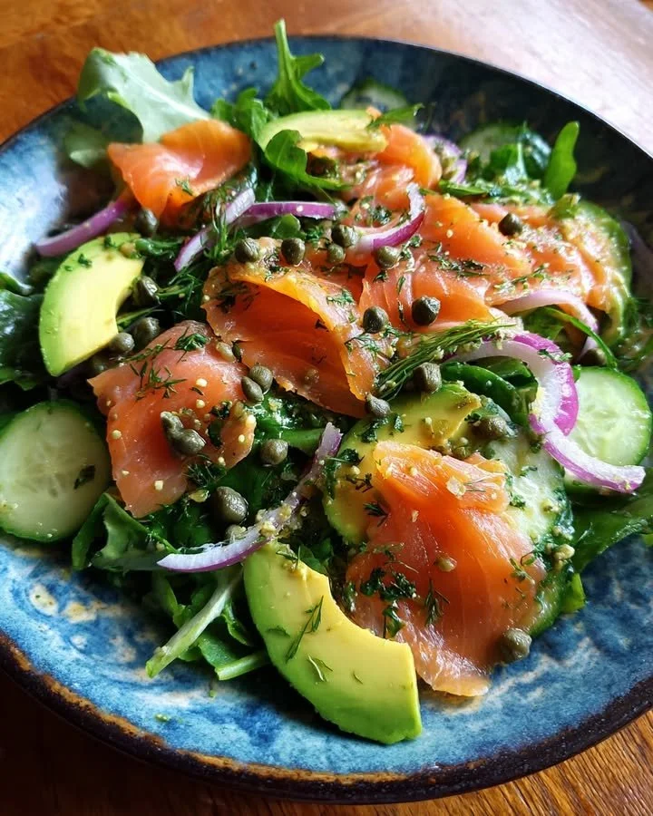 Smoked salmon and avocado salad served in a bowl with fresh ingredients