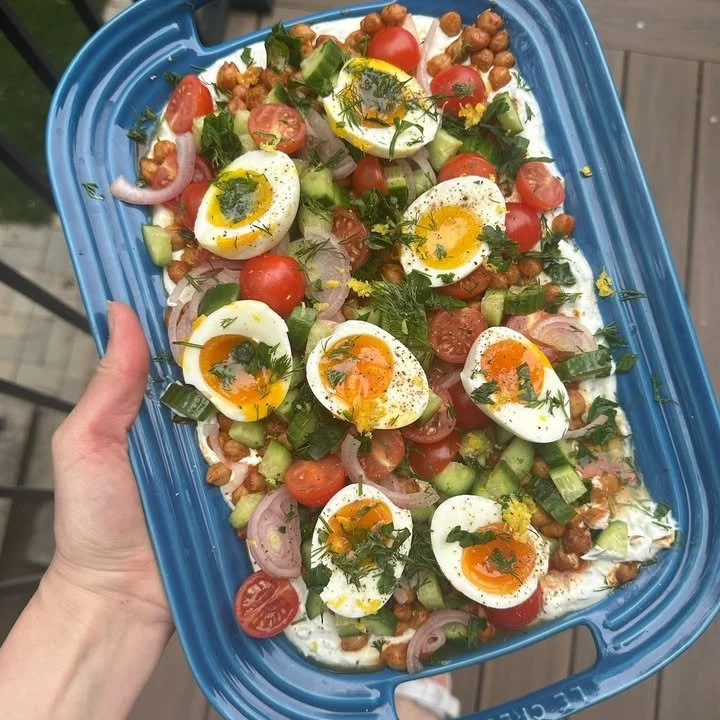 Spiced chickpeas and eggs served with herb garlic yogurt