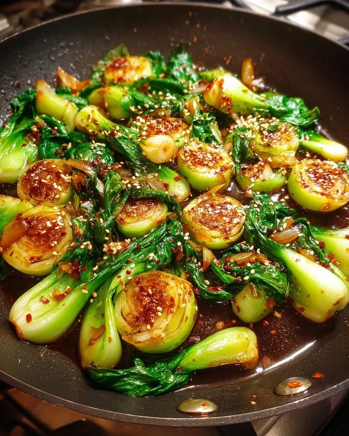 Stir-Fried Baby Bok Choy with a soy garlic glaze served on a plate