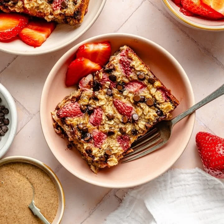 Delicious strawberry banana chocolate chip baked oatmeal served in a bowl