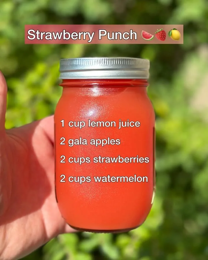 Refreshingly delicious strawberry punch in a glass with fresh strawberries