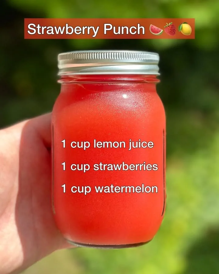 Delicious Strawberry Punch served in a chilled glass with fresh strawberries.