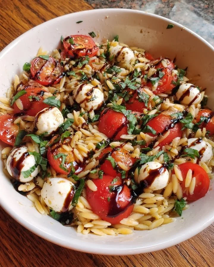 Delicious Summer Caprese Orzo Salad with fresh tomatoes, mozzarella, and balsamic glaze