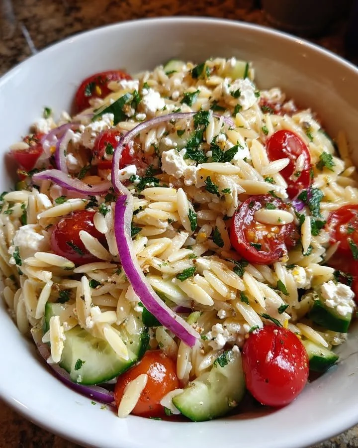 Colorful Summer Orzo Salad with vegetables and herbs
