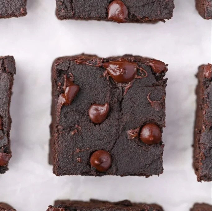 Delicious homemade sweet potato brownies on a wooden table.