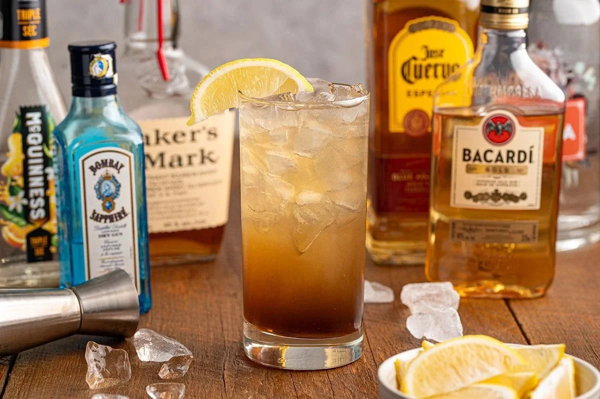 A refreshing glass of Texas Tea garnished with lemon and mint leaves.