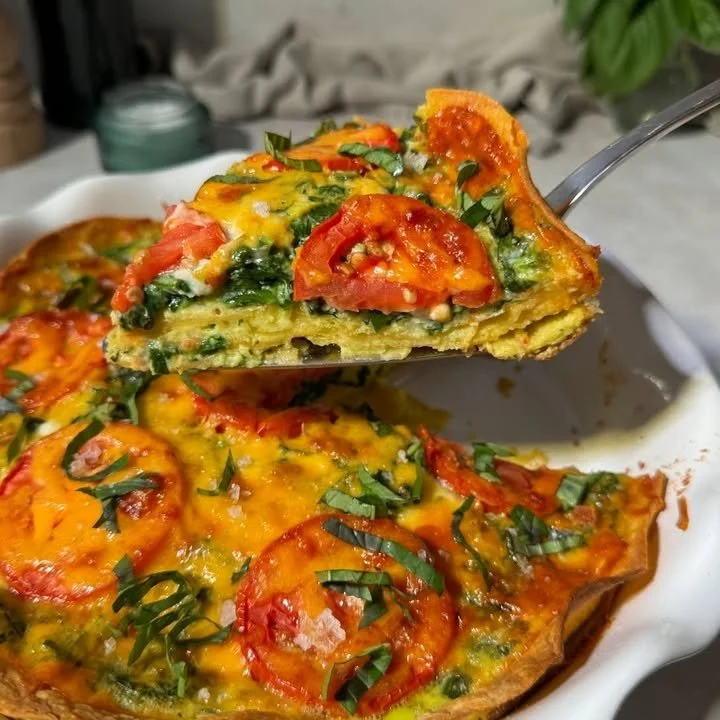 Delicious Tomato Basil Quiche with a crispy tortilla crust served on a plate.