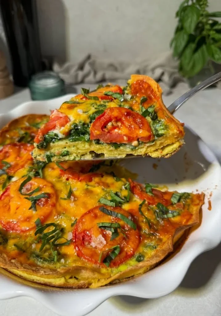 Delicious Tomato Basil Tortilla Quiche slice on a plate