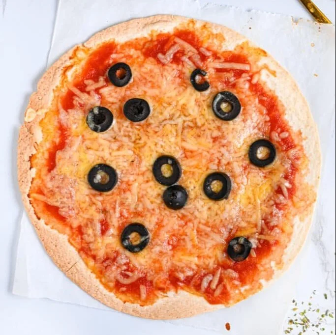 Delicious homemade tortilla pizza topped with fresh ingredients