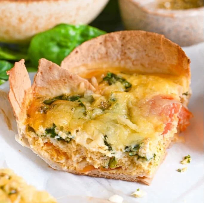 Tortilla Quiche Bake with colorful vegetables and cheese in a golden crust.