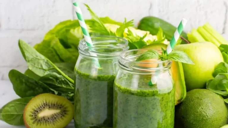 A vibrant bowl of Vitality Smoothie topped with fruits and seeds