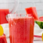 Refreshing watermelon lemonade in a glass with mint garnish