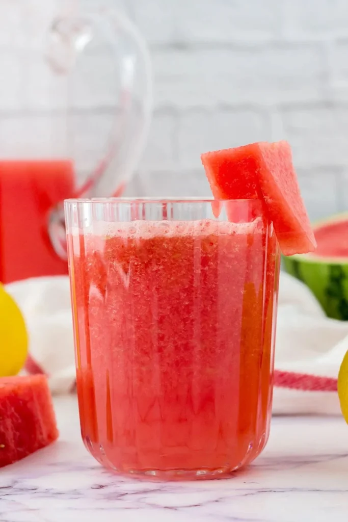 Refreshing watermelon lemonade in a glass with mint garnish